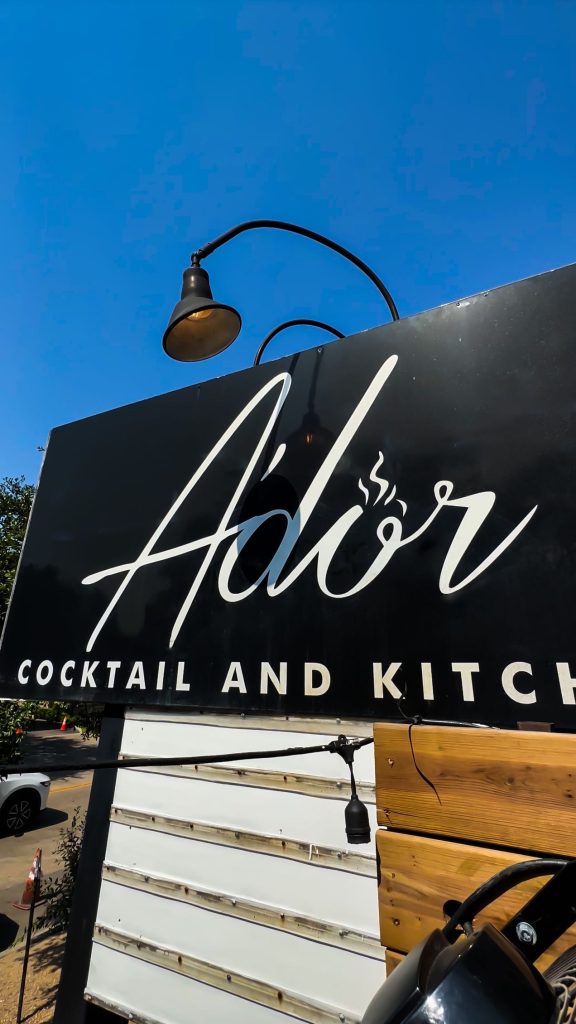 Ador Kitchen and Cocktail storefront signage on West Gray